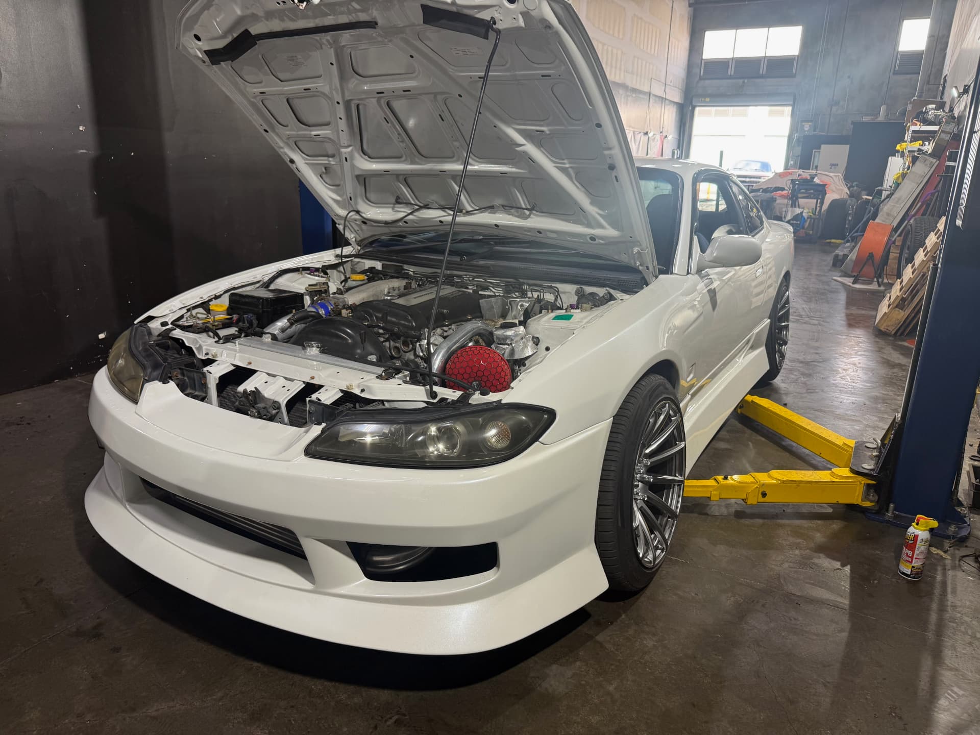 White Nissan Silvia S15 on the two-post lift
