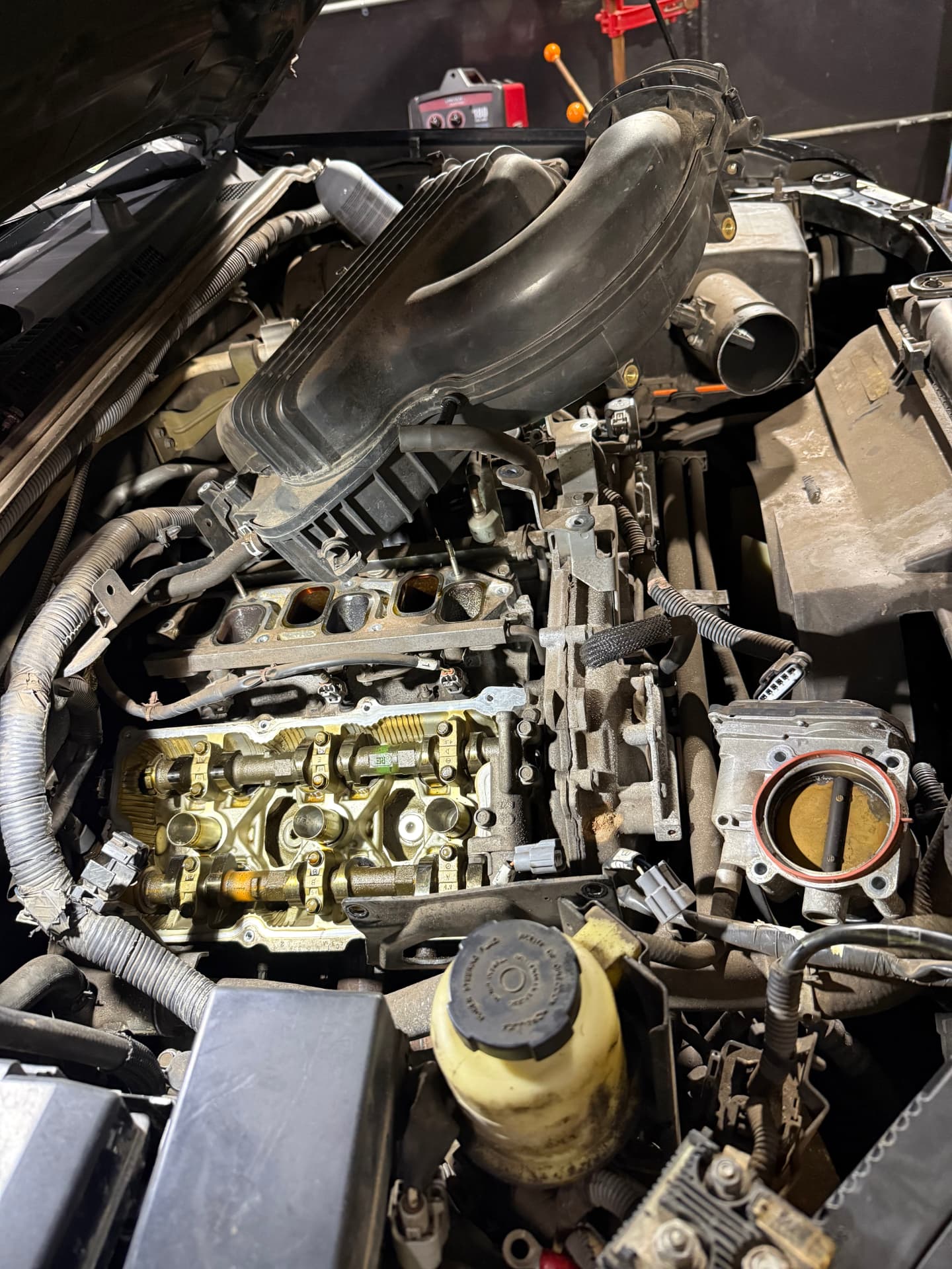 Engine bay torn down for a cylinder head job